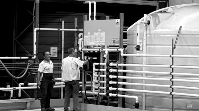 Liquidia team checking the plant control panel
